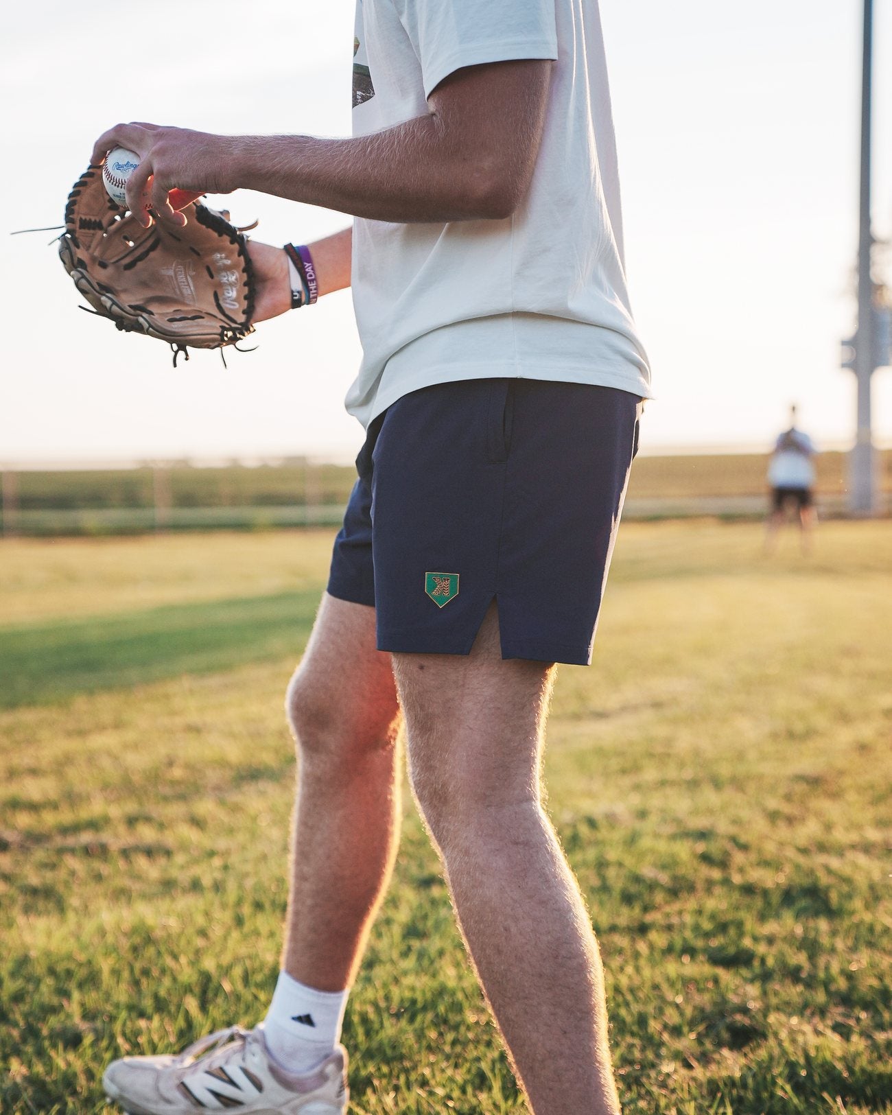 Mound of Dreams Shorts worn on the field at golden hour