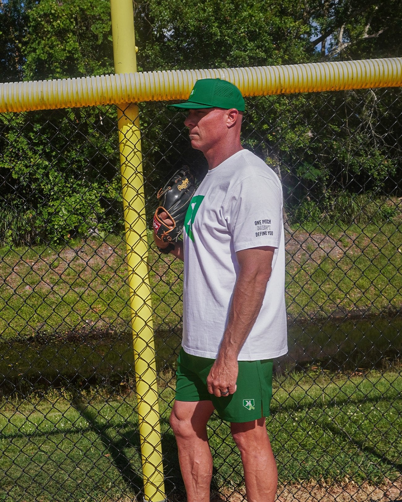 One Pitch Shorts in Kelly Green, front view with embroidered K