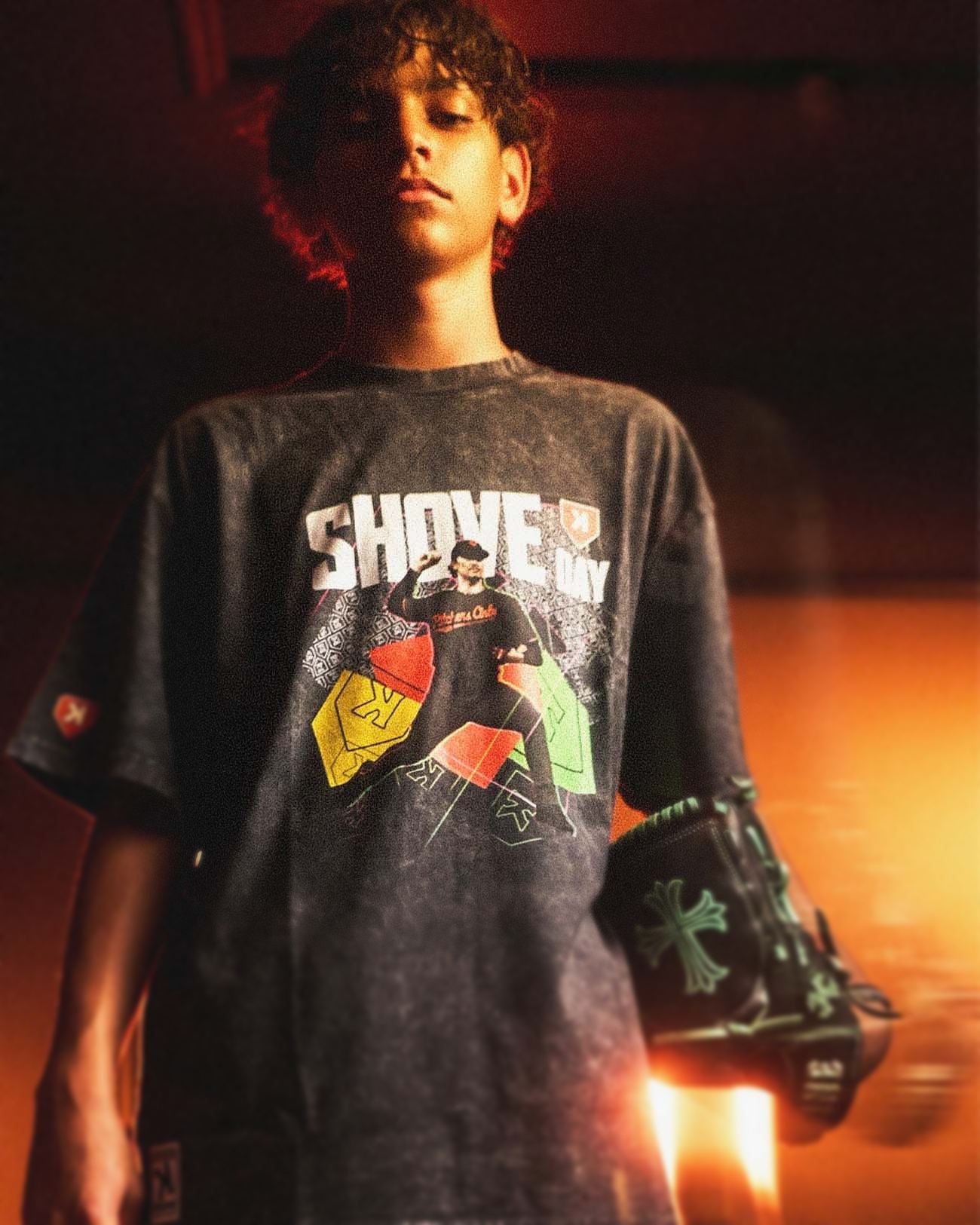 The Show Tee worn on field at night, SHOVE DAY graphic lit warm