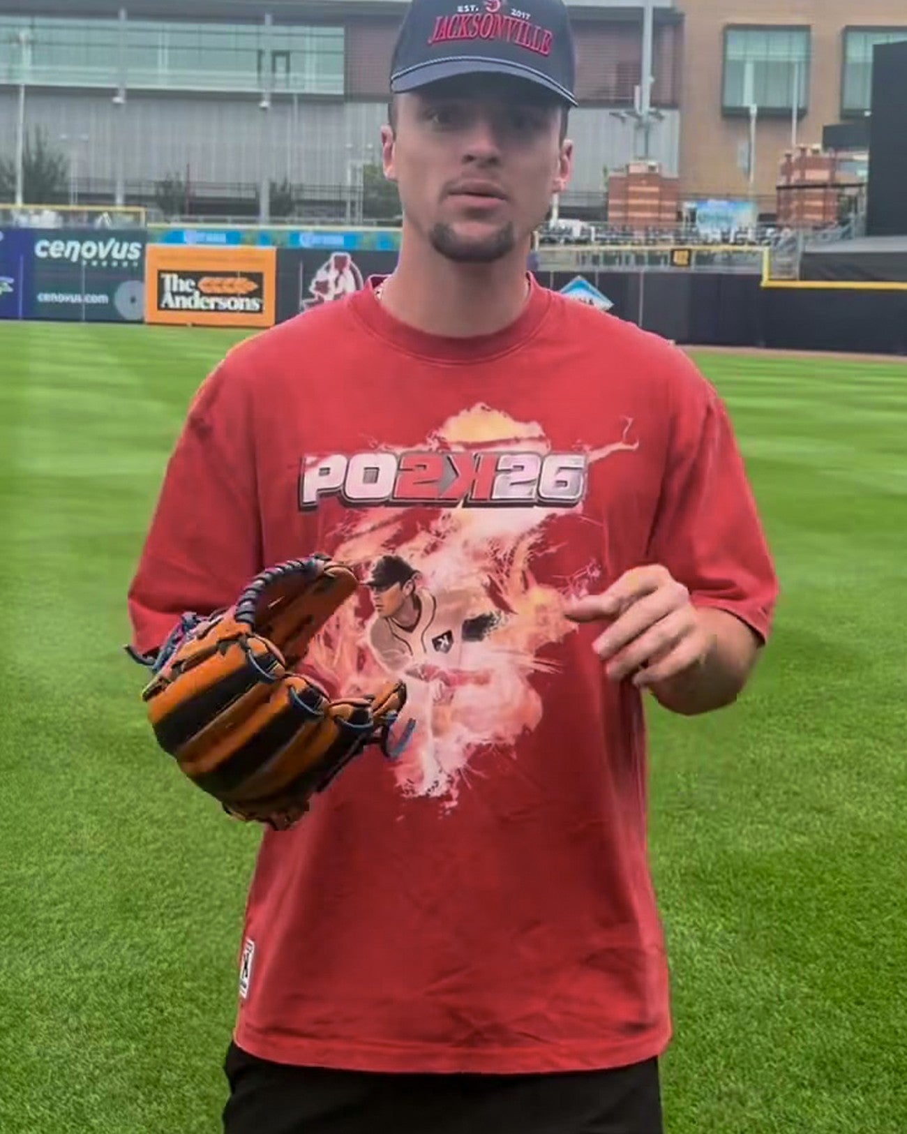 Youth PO2K Tee worn on field, PO2K26 cover-art graphic, red garment wash