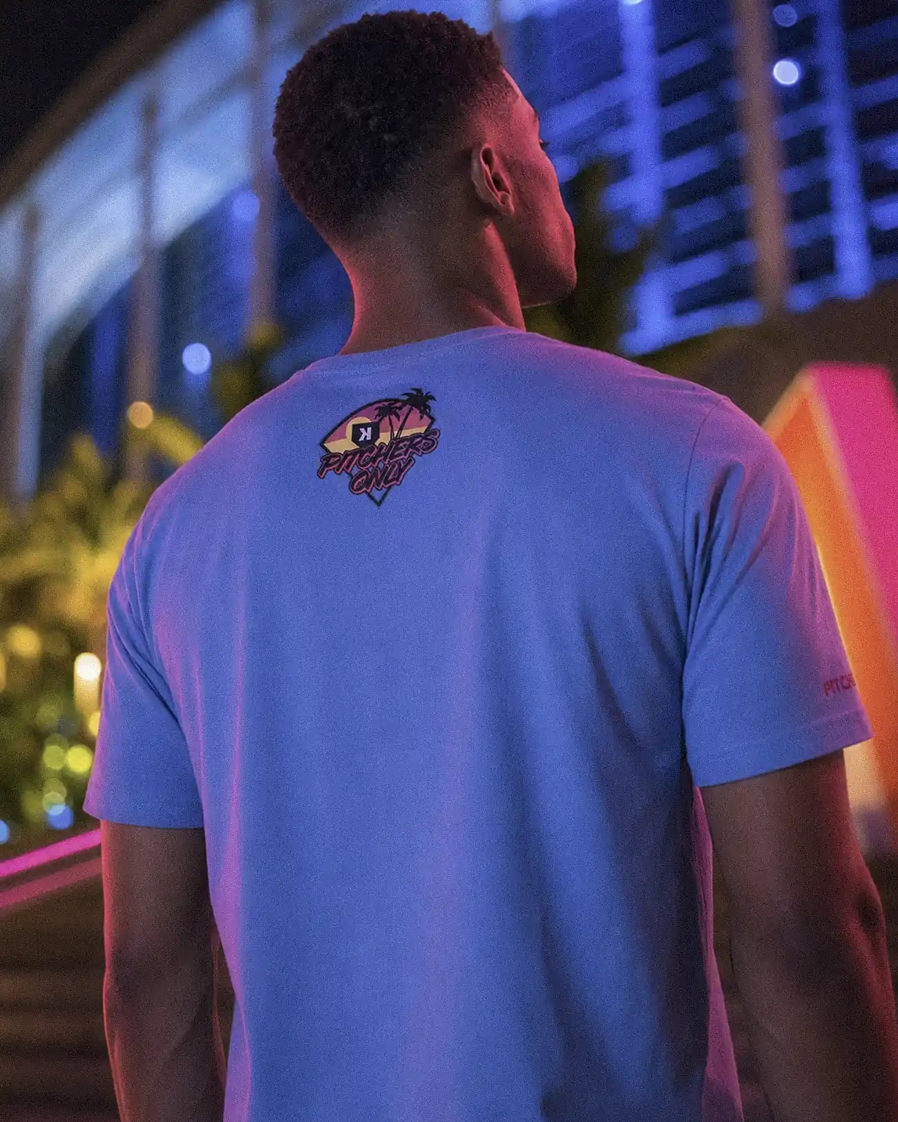 Back of the Summer Nights Tee worn, Pitchers Only sunset badge between the shoulders