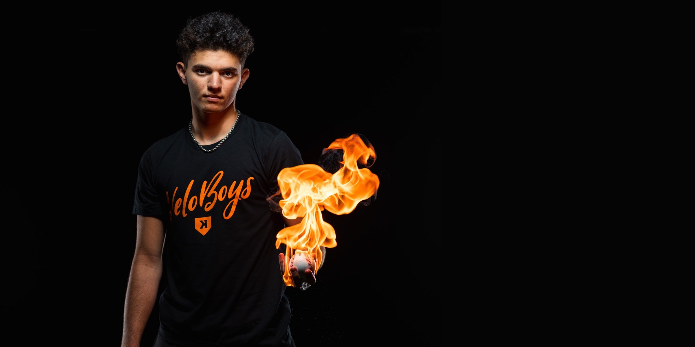 Pitchers Only ambassador holding a flaming baseball
